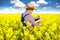 A Farmer inspects rapeseed