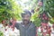 Farmer keeping fresh lychees and bunding up to sell in local market at ranisonkoil, thakurgoan, Bangladesh.