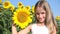 Farmer kid in sunflower agriculture field, teenager girl, child playing in agrarian harvest