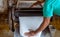 Farmer making rubber sheets hang on bamboo process dry by solar energy . A raw rubber latex flat to dry. Rubber sheet is a raw ma