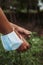 Farmer man wearing a surgical mask in his wrist