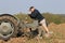 Farmer mending plough of old vintage tractors at ploughing match