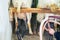 The farmer milks the goats using portable apparatus for machine milking