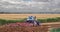 Farmer Mulching corn stubble back into the soil.