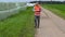 Farmer numbering and walking near hay bales