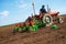 Farmer in Old-fashioned tractor