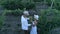 Farmer pair in countryside at vineyard communicate during harvesting, aerial view