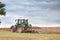 Farmer ploughing overwintered fields