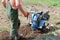 Farmer plowing the land. Tillage cultivator. Land cultivation