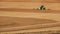 Farmer plows with his tractor on his farm for peanuts planting in the rural area