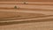 Farmer plows with his tractor on his farm for peanuts planting in the rural area