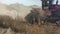 Farmer plows the land in a field in the countryside.