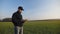 Farmer with portable tablet computer in a wheat field