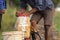 Farmer prepare chemical to sprayer tank before spray to green yo