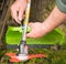 Farmer prepares grass mower for work