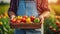 Farmer proudly displaying box of freshly picked vegetables against sunny farm backdrop