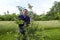 Farmer Pruning A Organic Apple Tree