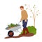 Farmer pushing wheelbarrow with spring seedling. Farm worker going with garden cart. Working in the vegetable garden in