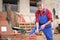 Farmer repairing his red tractor