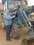 Farmer repairing tractor 2