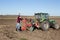 Farmer repairing tractor