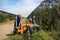 Farmer repairing valve irrigation system in orchard