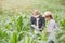 Farmer and researcher analysing corn plant
