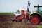 Farmer seeding crops at field