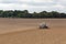 Farmer seeding crops at field