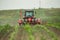 Farmer seeding, sowing crops at field