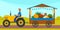 Farmer is selling vegetables, autumn harvest festival time. Man rides tractor carries trading tray