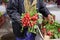 farmer show ripe fresh radishes in a market