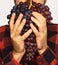 Farmer shows his harvest. Winegrower holds cluster of ripe grapes