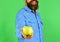 Farmer with smile holds fresh apple. Farming and autumn products