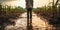 Farmer standing in a flooded cornfield reflecting on climate changes impact on agriculture food security and rural economy