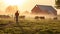 Farmer standing in front of his herd of cows in the morning