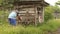 The farmer standing on his knees as tall as grass