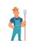 Farmer standing and holding agricultural tool or farm fork.