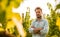 Farmer standing proud in front of a vineyard - agriculture