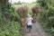 Farmer with straw baskets, Bali