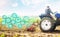 Farmer on a tractor cultivates a farm field and technological innovation gears hologram. Science of agronomy. Farming and