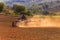 Farmer tractor with disc harrow system working on a stubble field