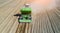 A farmer and tractor in the field planting potatoes in the fertile farm fields. Aerial view