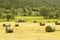 Farmer on tractor with hay bales