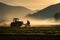 Farmer with tractor at work in the field at sunrise. Tractor preparing land for sowing, Farmer operating a tractor working in the