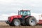 Farmer tractor working in the field. Spring time for sowing.