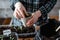 Farmer transplants tomato and pepper seedlings into peat cups