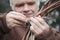 Farmer Tying Raspberry Branch