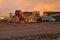 Farmer unloading sugarbeets from truck onto a piler at a beet dump