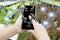 Farmer use smartphone monitor operation robotic arms harvesting Agricultural products futuristic organic vegetable farm,concept